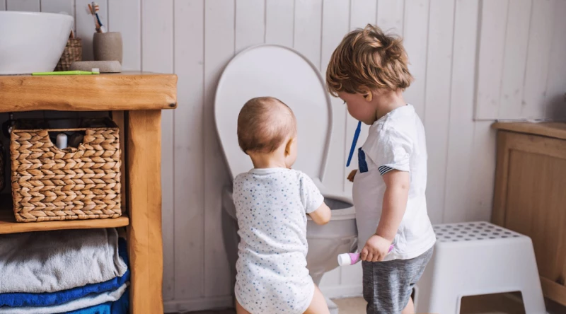 A blocked toilet drain caused by foreign objects being flushed